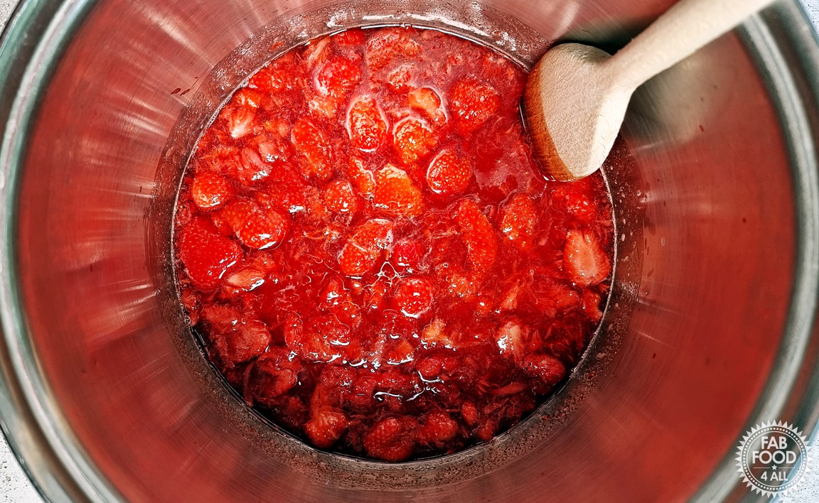 Strawberry & Gin Jam ingredients in a pan on a low heat to dissolve the sugar.