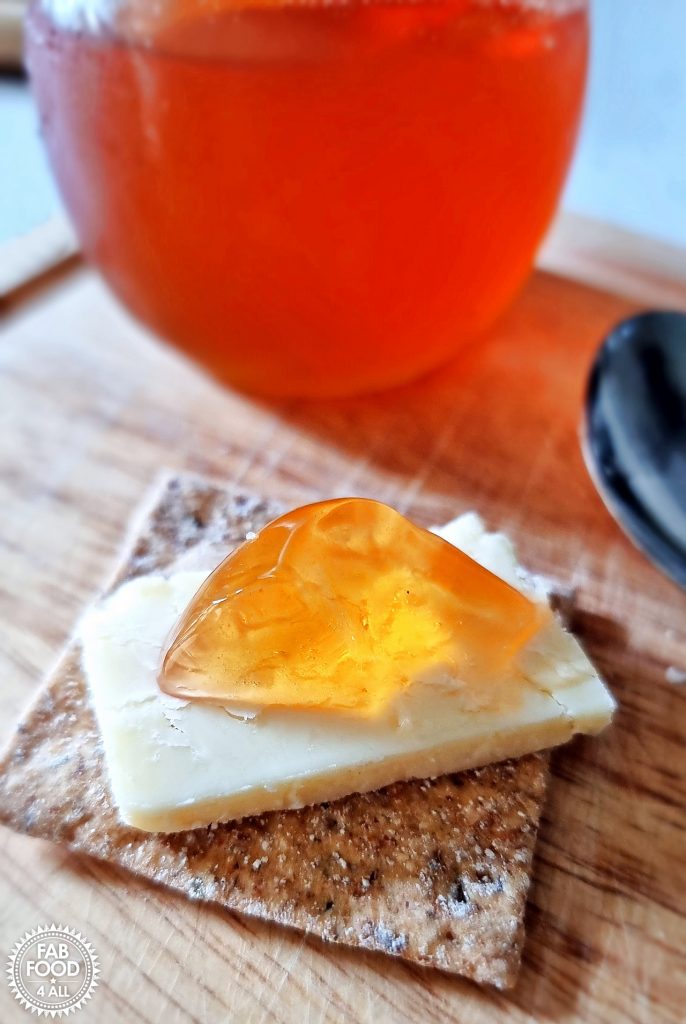 Rosehip & Apple Jelly on a Cracker with Cheddar Cheese.