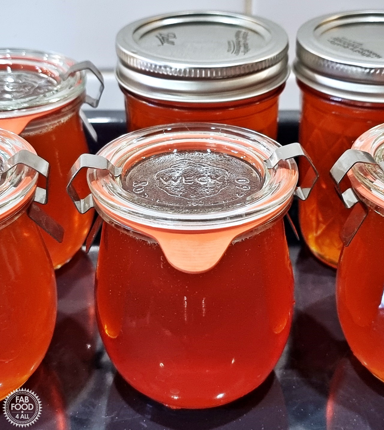 Potted up jars of Rosehip and Jelly with lids on.