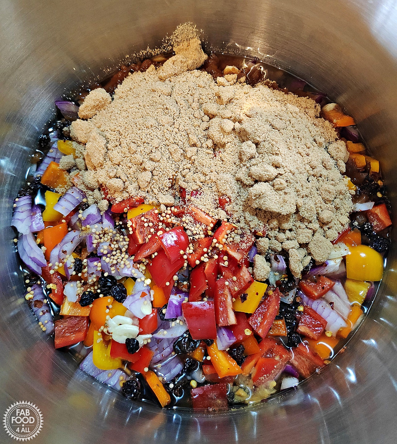Spicy Baby Tomato & Sweet Pepper Chutney ingredients in a pan minus the cherry tomatoes.