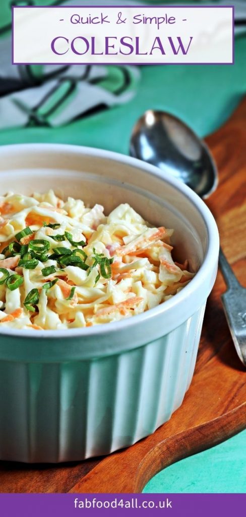 Coleslaw Pinterest Image - bowl of coleslaw on a board with serving spoon.