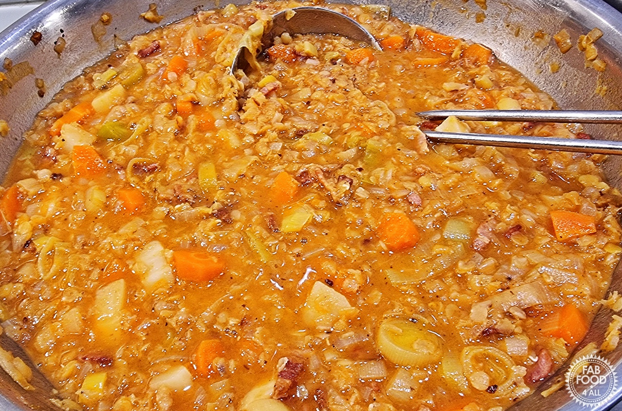 Glenda's Winter Lentil Soup in a stainless steel pan.