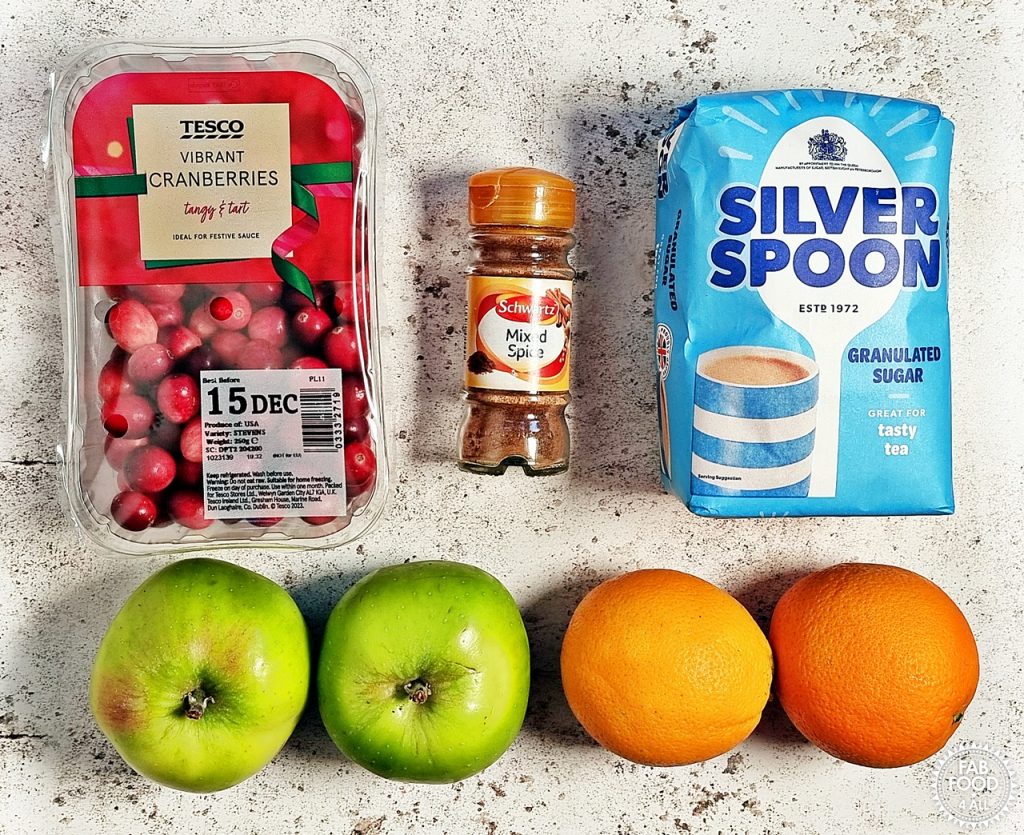 Easy Christmas Jam recipe ingredients: cranberries, mixed spice, granulated sugar, 2 cooking apples and 2 oranges.