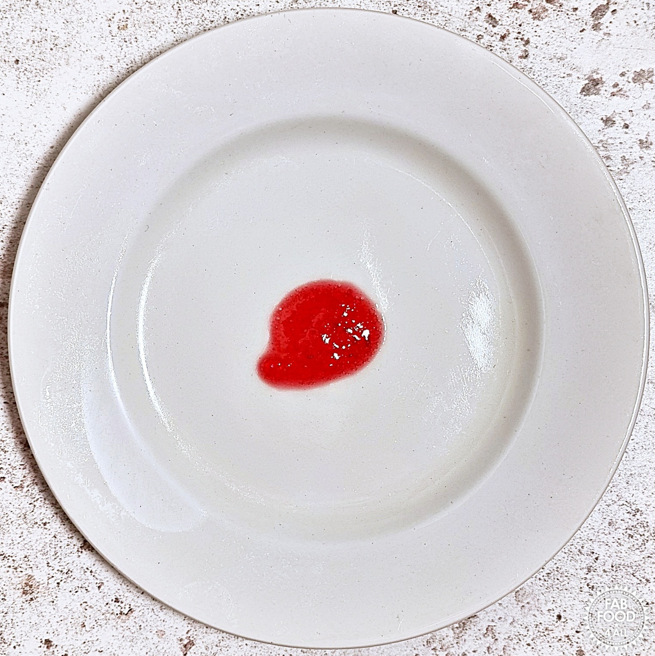 A few drops of Easy Christmas Jam on a chilled plate ready for testing.