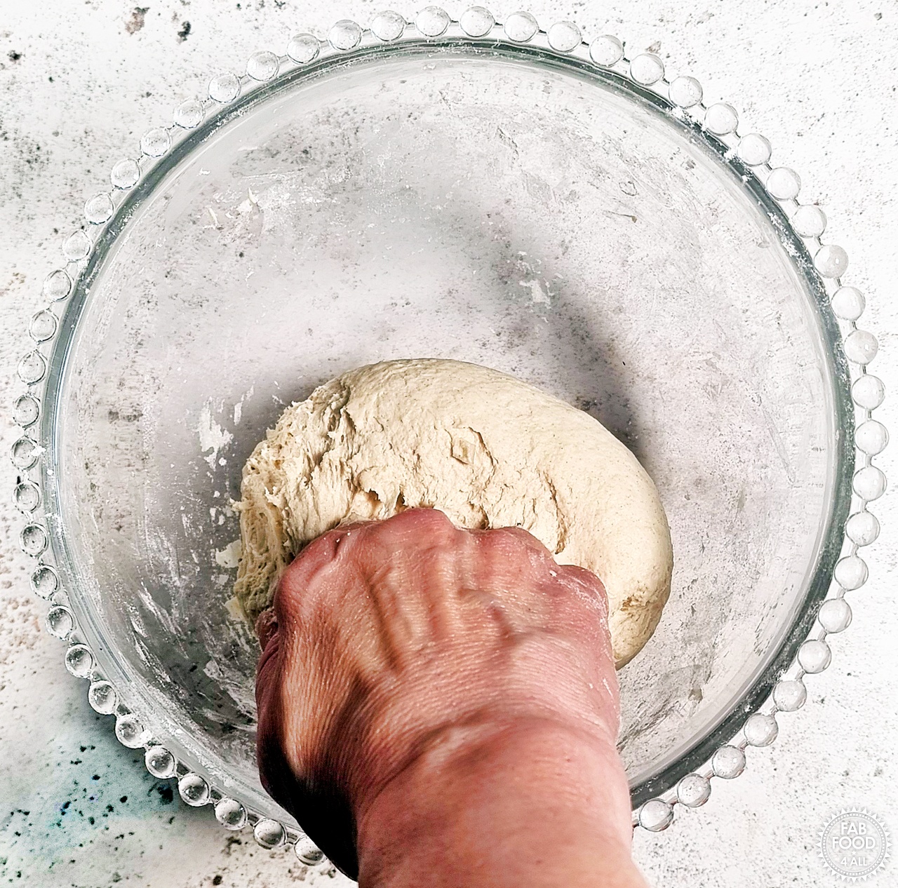 Easy Spelt Yogurt Flatbread dough being kneaded in a mixing bowl.