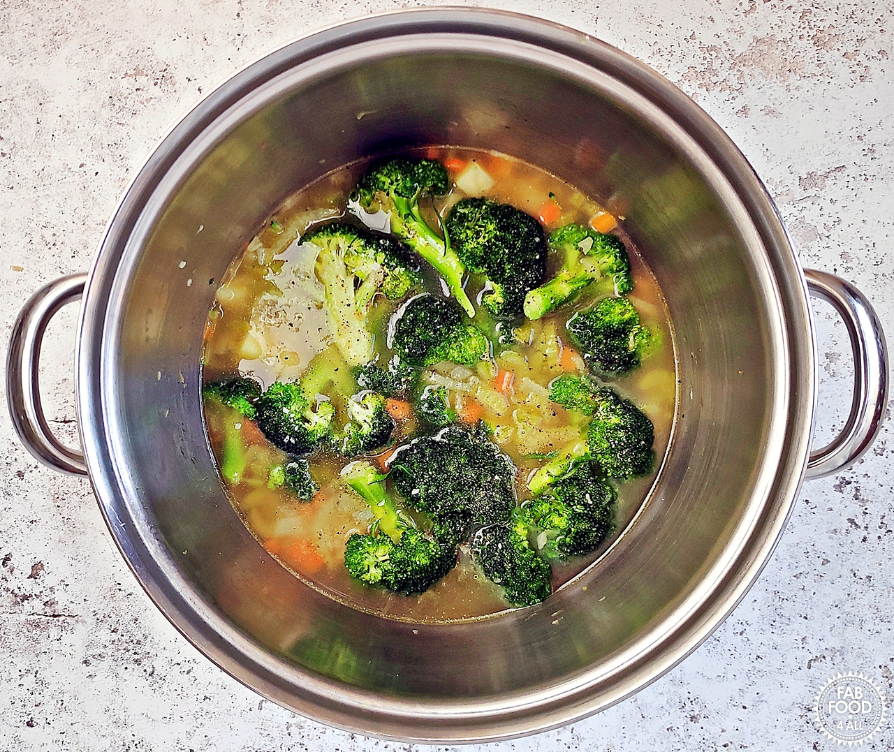 Soup pot with added stock.