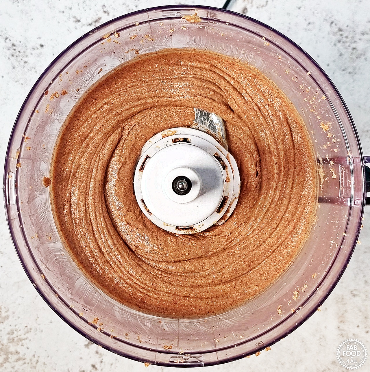 Peanut butter fully blended in food processor.