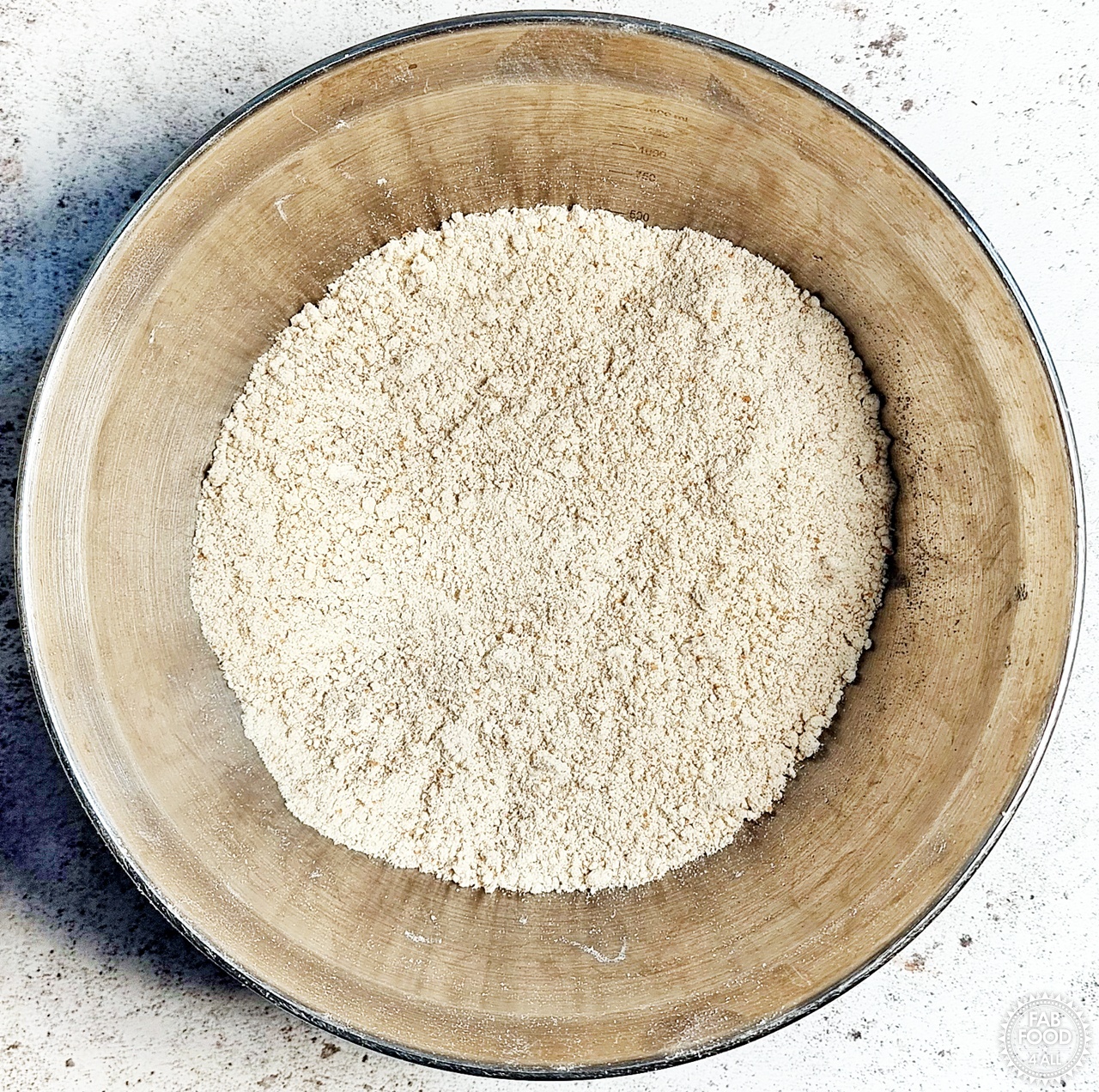 Spelt flours, baking powder and butter after being rubbed in to resemble breadcrumbs.