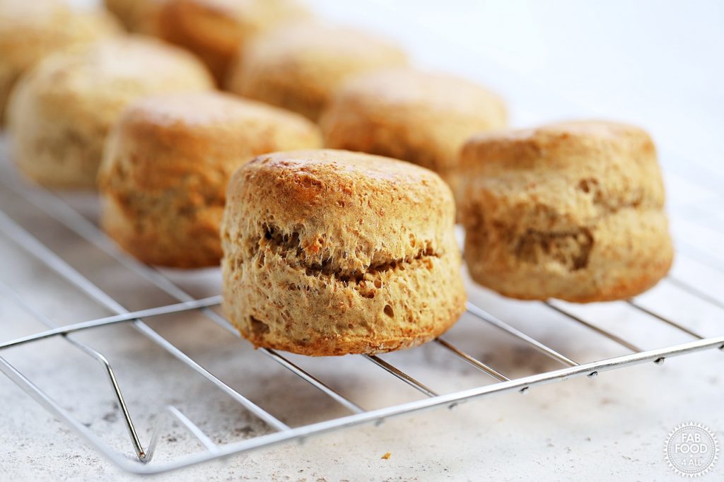 Spelt scones on a wire rack close up.