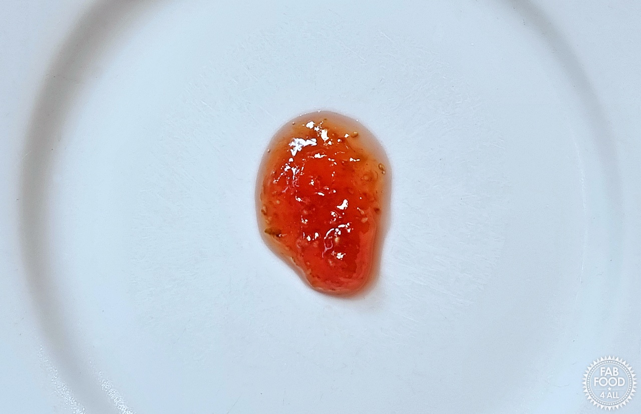 A few drops of fig jam on a cold plate for the chilled plate test.