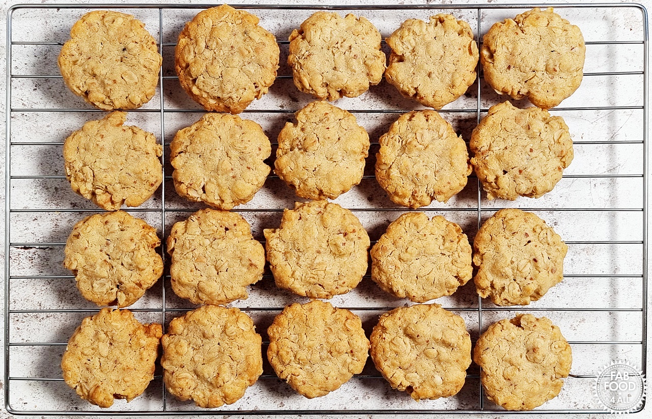 Overhead shot of Savoury Spelt Cookies with Cheddar & Peanut Butter on a wire rack.