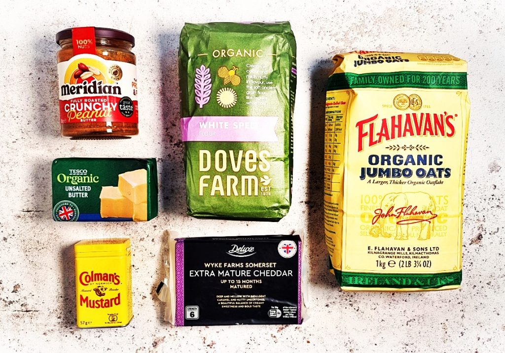 Spelt Cheddar Peanut Butter Cookie ingredients: Crunchy Peanut Butter jar, pack of White spelt flour, Flahavan's Organic Jumbo Oats, pack of organic unsalted butter, tin of Colman's Mustard and pack of Extra Mature Cheddar.